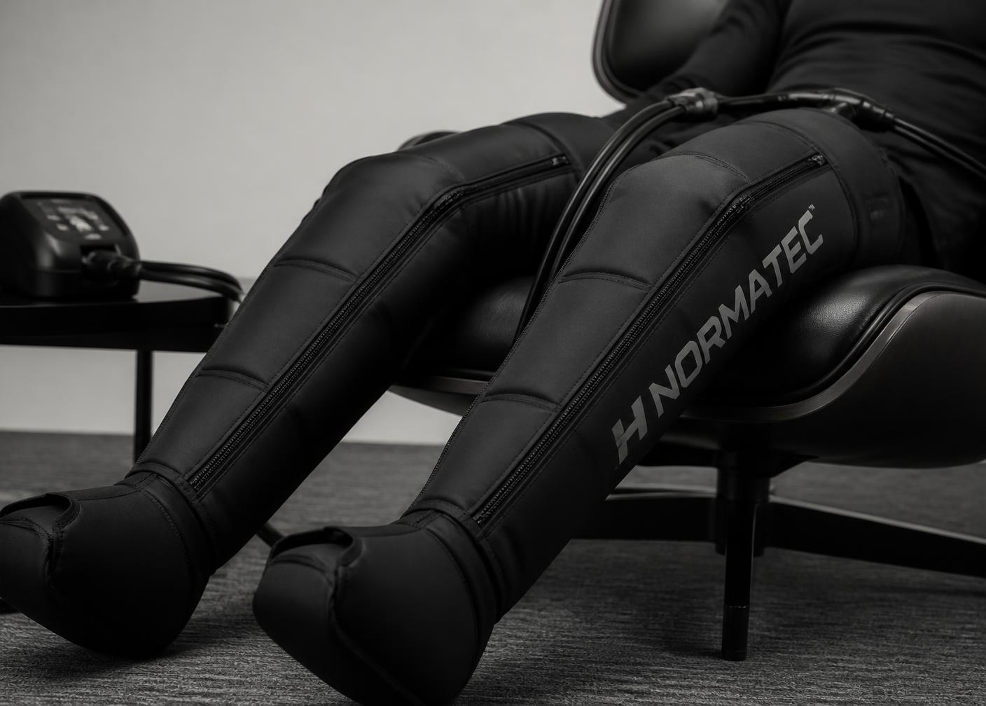 Athletic pneumatic compression sleeves in use